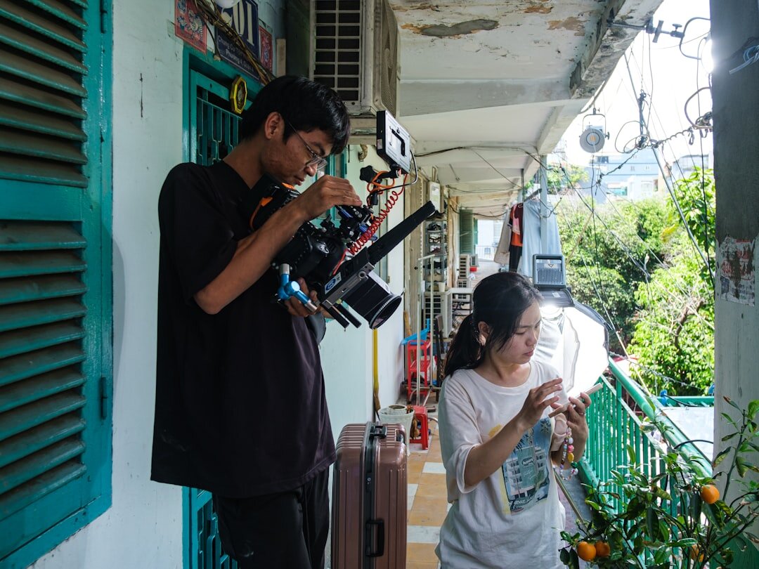 Photographer conducting an interview and photo session with a local craftsman