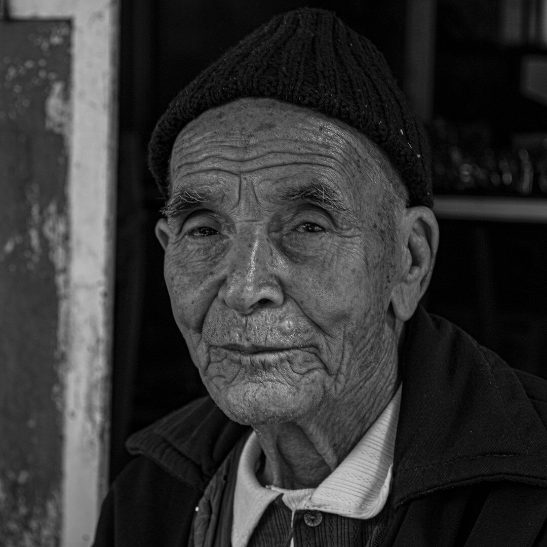 Portrait of an elderly Danish fisherman with weathered face and wool sweater